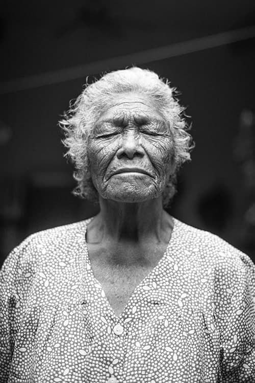 Elderly woman with eyes closed with alzheimer's disease/dementia.