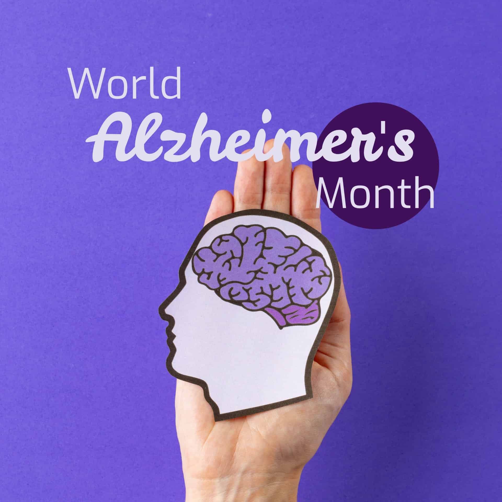 World alzheimer's month text over caucasian female hand holding head with purple brain